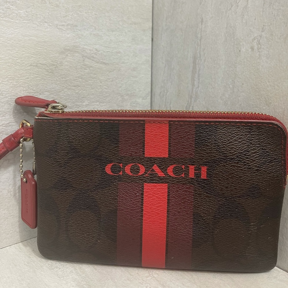 COACH corner zip wristlet in signature canvas